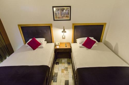 Katil atau katil-katil dalam bilik di Hotel Galaxy