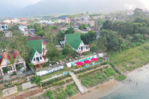 an aerial view of a town next to the water at Carambola Bungalow in Phong Nha