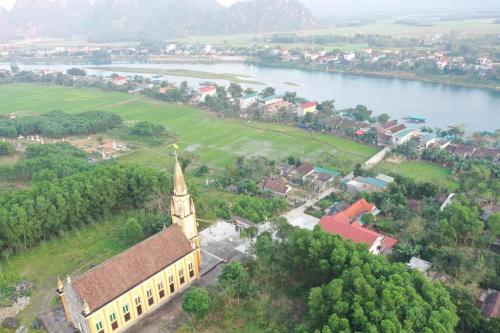 an aerial view of a church next to a river at Carambola Bungalow in Phong Nha