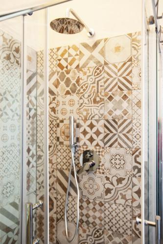 a bathroom with a shower with a glass door at Cinque Terre Mon Amour in La Spezia