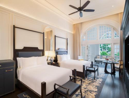Cama o camas de una habitación en Raffles Singapore