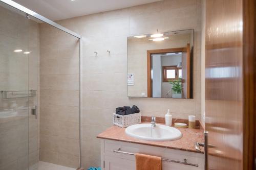 a bathroom with a sink and a shower at Casa Jimena in Punta de Mujeres