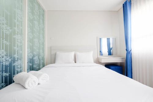 Postel nebo postele na pokoji v ubytování Cozy and Modern 1BR Apartment at Atlanta Residences By Travelio