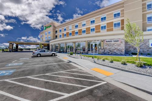 a car parked in a parking lot in front of a hotel at Holiday Inn - Nampa by IHG in Nampa