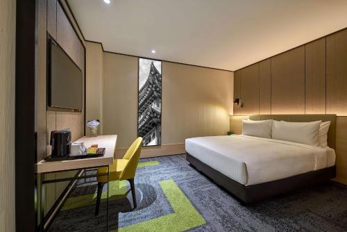 a hotel room with a bed and a desk with a computer at Aerotel Kuala Lumpur (Airport Hotel) - Gateway@klia2 in Sepang