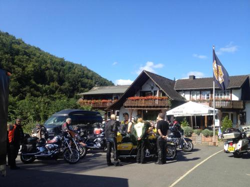 a group of motorcycles parked in front of a building at Hotel Forsthaus in Volkesfeld