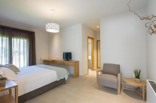 Ένα ή περισσότερα κρεβάτια σε δωμάτιο στο Almyra Villas