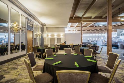 a conference room with a long table and chairs at enVision Hotel & Conference Center Mansfield-Foxboro in Mansfield