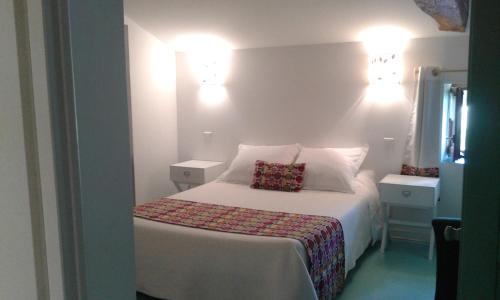 Ένα ή περισσότερα κρεβάτια σε δωμάτιο στο Les Croisettes