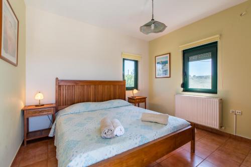 Postel nebo postele na pokoji v ubytování Ellie Villa