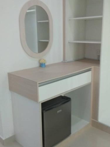 a bathroom with a sink and a mirror at Captain's Cabin Resort - Naval Heritage (Swimming Pool) in Kota Bharu