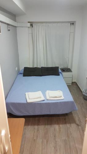 Katil atau katil-katil dalam bilik di Guesthouse Central