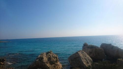 a view of the ocean with rocks in the water at Sapphire L44 in Iskele