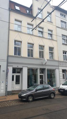 a gray car parked in front of a building at Goethe 3 - Mitten im Zentrum von Schwerin in Schwerin