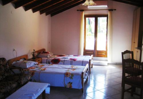 Llit o llits en una habitació de Sun House Apartments in Eftalou