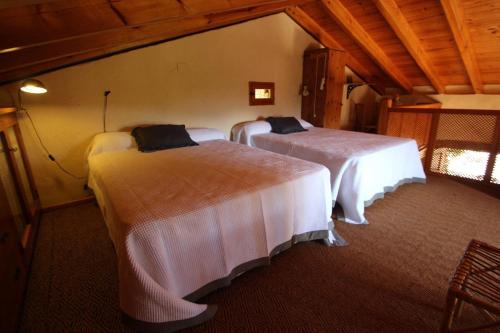 A bed or beds in a room at Rocasol - rustic finca for nature lovers in Benissa