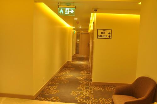 a hallway with a sign that reads no people at Days Hotel Jaipur Tonk Road By Wyndham in Jaipur