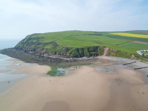 an aerial view of a beach next to the ocean at Seacote Hotel in St Bees