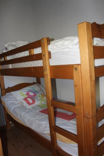 a bunk bed with a mattress on the bottom bunk at La Ferme de Sous-Lachat in Samoëns