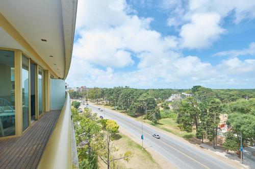 a balcony of a building with a view of a road at Albar Club de Mar in Pinamar