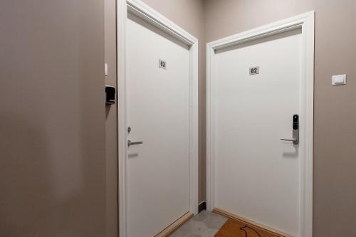 two doors in a room with a corridor at Residential Barona Apartments in Riga Centre in Rīga