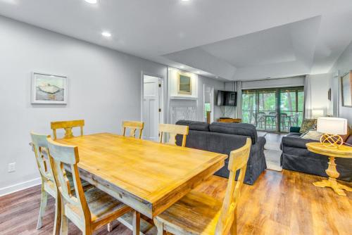 a living room with a wooden table and a couch at Night Heron 4117 in Kiawah Island