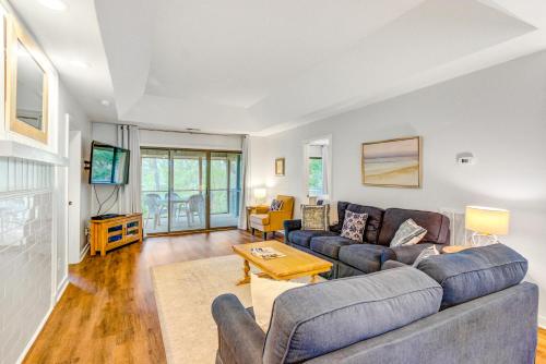 a living room with a couch and a table at Night Heron 4117 in Kiawah Island