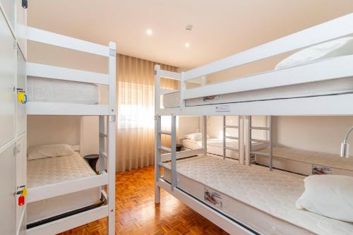 Poschodová posteľ alebo postele v izbe v ubytovaní Sleep&Go