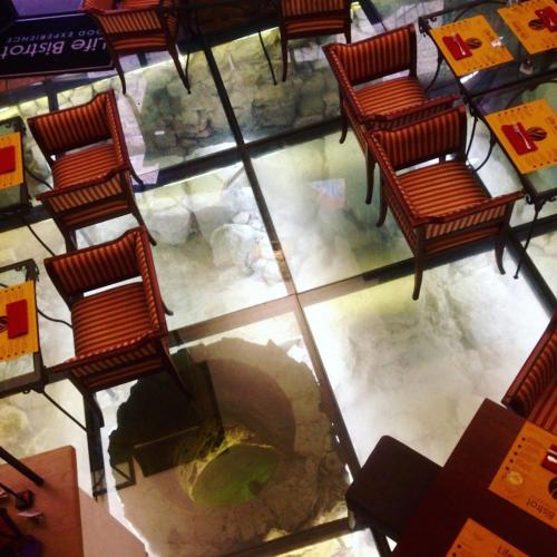an overhead view of a restaurant with chairs and a fireplace at Appartamento Matteotti in Volterra