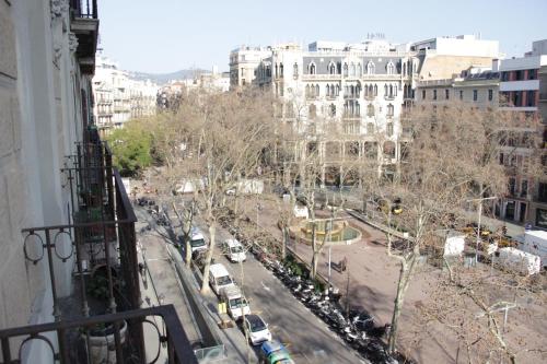 a view of a city street with cars and buildings at Mr. Serrano Apartments in Barcelona