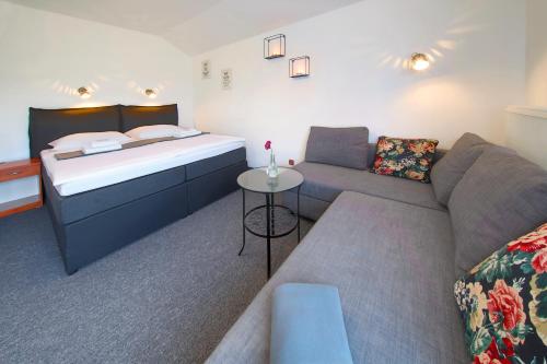 Una cama o camas en una habitación de Hotel BRADA