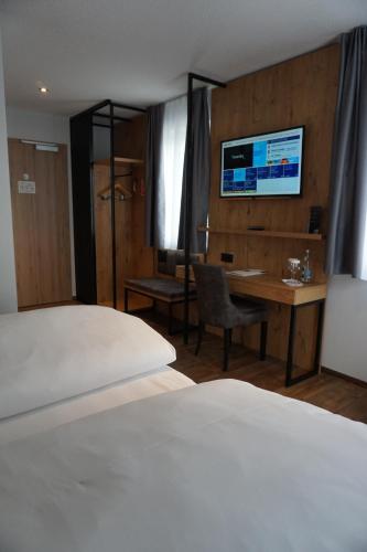 Postel nebo postele na pokoji v ubytování Hotel Grüner Baum