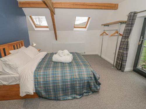 Ένα ή περισσότερα κρεβάτια σε δωμάτιο στο Rhydau Cottage