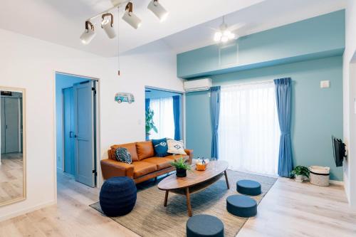 a living room with a couch and a table at Nagisa no Shiroi Ie Laguna / Vacation STAY 73153 in Isumi