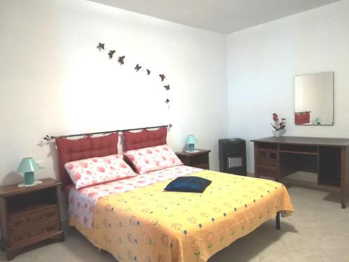 En eller flere senge i et værelse på La Casa Degli Ulivi