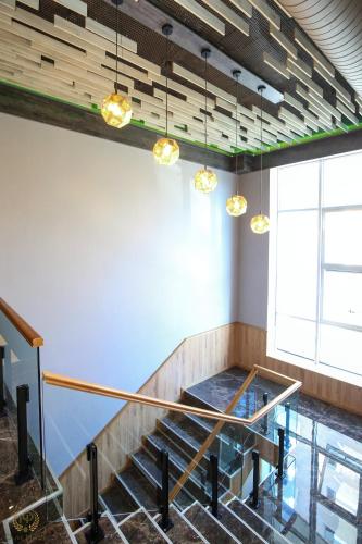 a room with a staircase with a glass floor at Hotel Olive in Vlorë