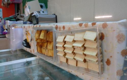 a plastic container filled with blocks of cheese on a counter at King Villa in Heping