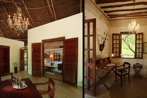 a room with a dining room and a bedroom at The Red Pepper House in Lamu