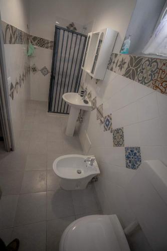 a bathroom with a toilet and a sink at B&B Confine in Como