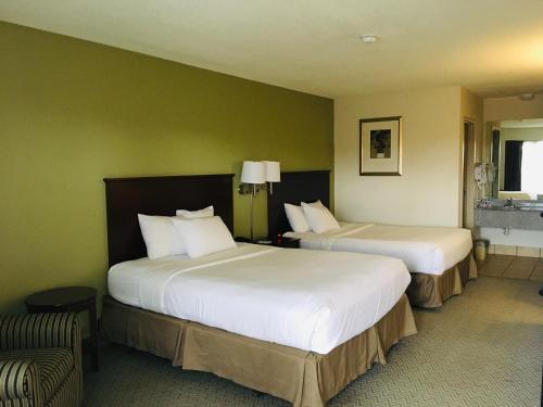 阿肯色州貝茨維爾華美達酒店房間的床