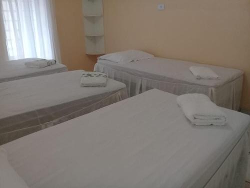 Cama ou camas em um quarto em Pousada Paraíso da Serra
