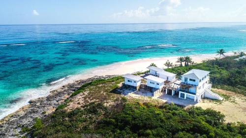 an aerial view of a house on a beach at Mika's Resort in Colebrooke Dale