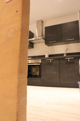 Η κουζίνα ή μικρή κουζίνα στο Le refuge des arènes