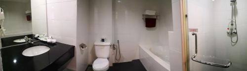 a bathroom with a sink and a toilet and a shower at Good Hope Hotel in Skudai
