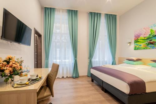 Posteľ alebo postele v izbe v ubytovaní Global Suites Budapest