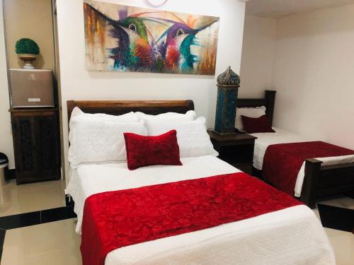 En eller flere senge i et værelse på Hotel Boutique Campanario del Río