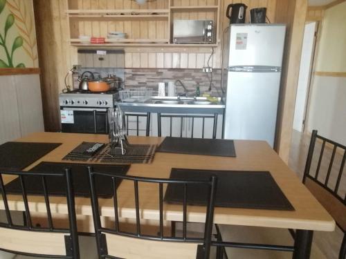 Cuisine ou kitchenette dans l'établissement Apart "Villa Antonia" Cabañas y Departamentos Delegaciones