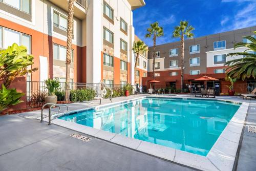an image of a swimming pool in a apartment building at Holiday Inn Express Fremont - Milpitas Central by IHG in Fremont