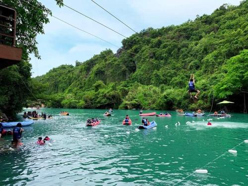 a group of people on kayaks in a river at Thien Thanh Hotel in Phong Nha