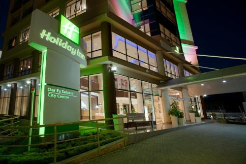a building with a sign on the front of it at Holiday Inn Dar Es Salaam by IHG in Dar es Salaam